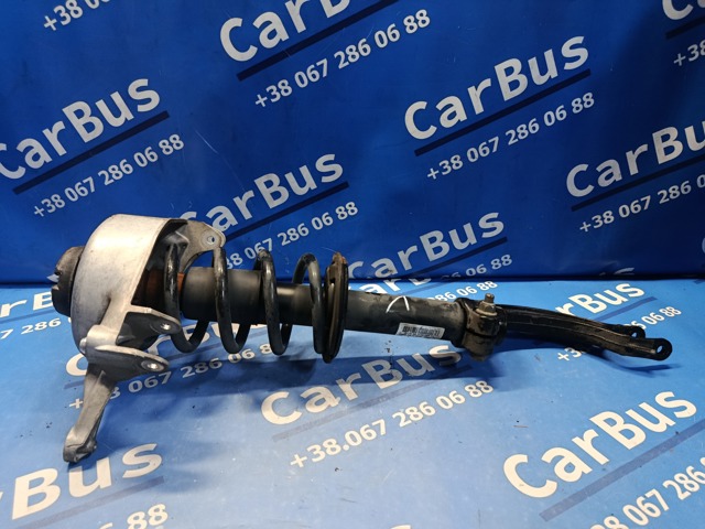 Стойка амортизатора передняя 8R0413031BE VAG