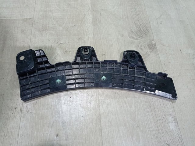 Лівий кронштейн кріплення бампера заднього DGH951U40 MAZDA