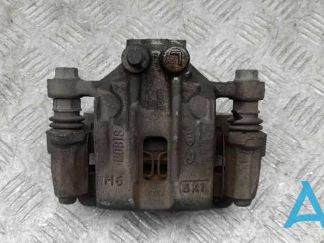 Задній гальмівний супорт лівий 58210C1150 HYUNDAI