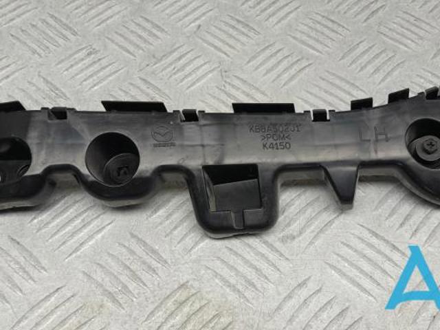 Напрямна заднього бампера, ліва KB8A502J1B MAZDA