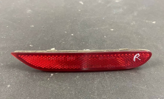 Відбивач бампера заднього правий 26560JJ90A NISSAN