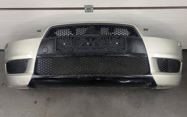 Кожух бампера переднього 6400B914 MITSUBISHI