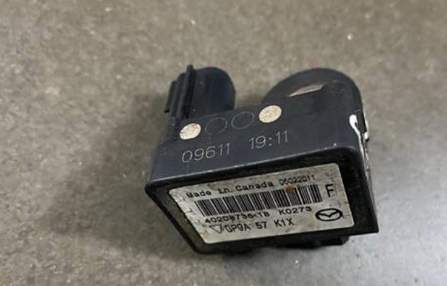 Датчик подушки безпеки GP9A57K1X MAZDA