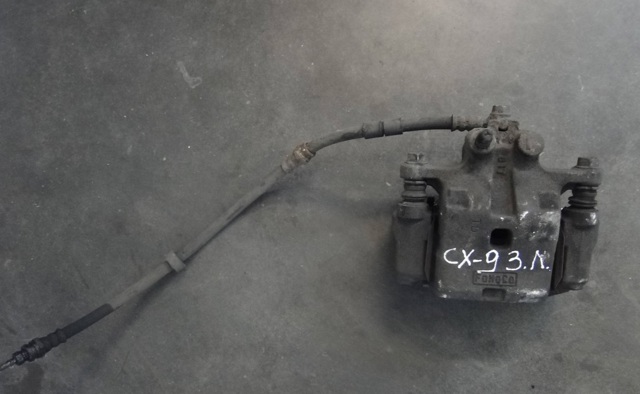 Задній гальмівний супорт лівий L2Z22699ZA MAZDA