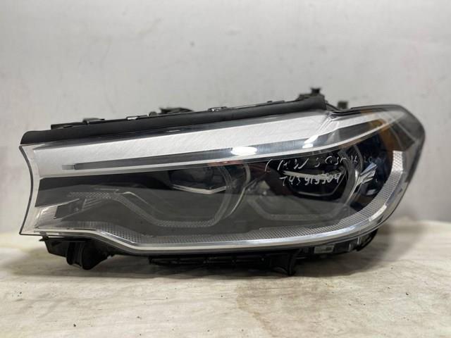 Фара основна ліва 7214961 BMW