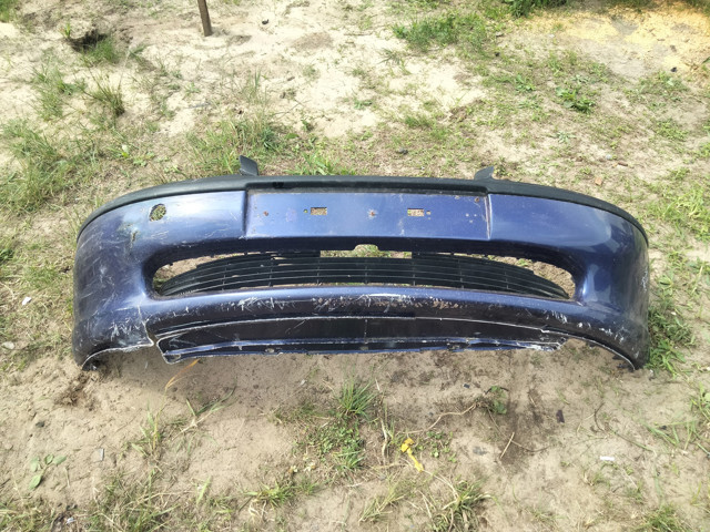 Бампер передній 90464527 OPEL