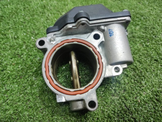 Дросільна заслінка в зборі 057128063G VAG