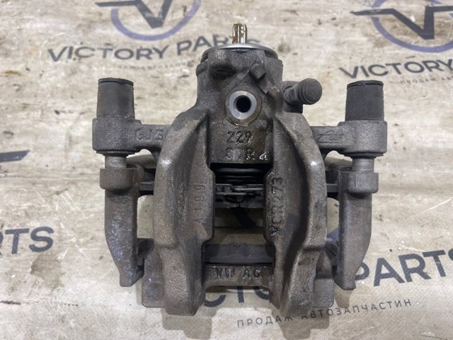 Задній гальмівний супорт лівий 3Q0615423FSL7 VAG