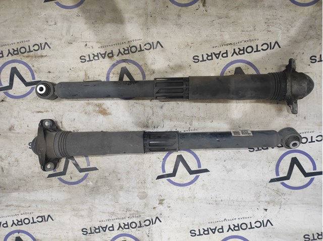 Стійка амортизатора задня Ауді Ку 3