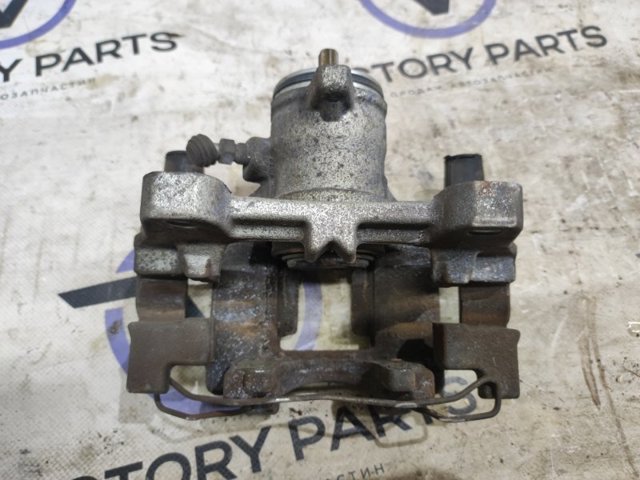 Супорт гальмівний задній правий DG9Z2552C FORD