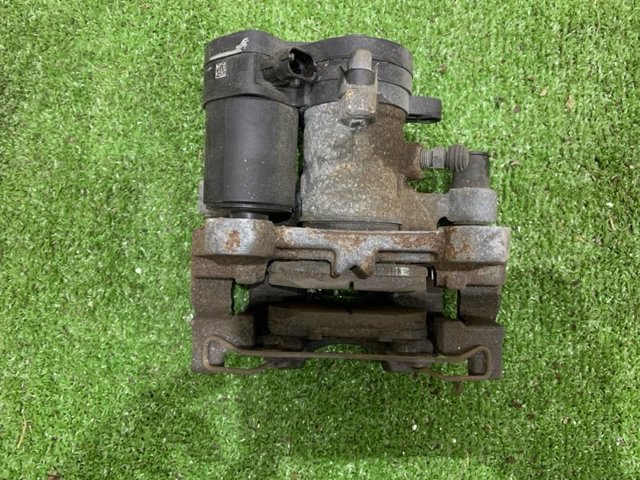 Задній гальмівний супорт лівий DG9Z2553C FORD