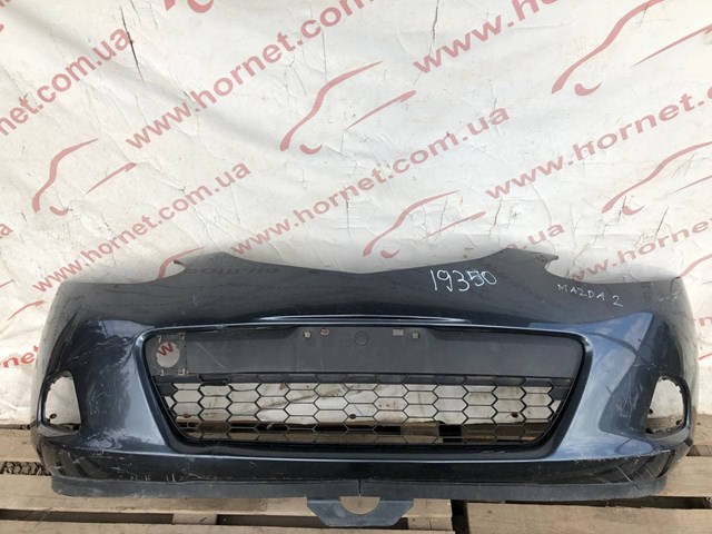 Бампер на авто D65150031 MAZDA