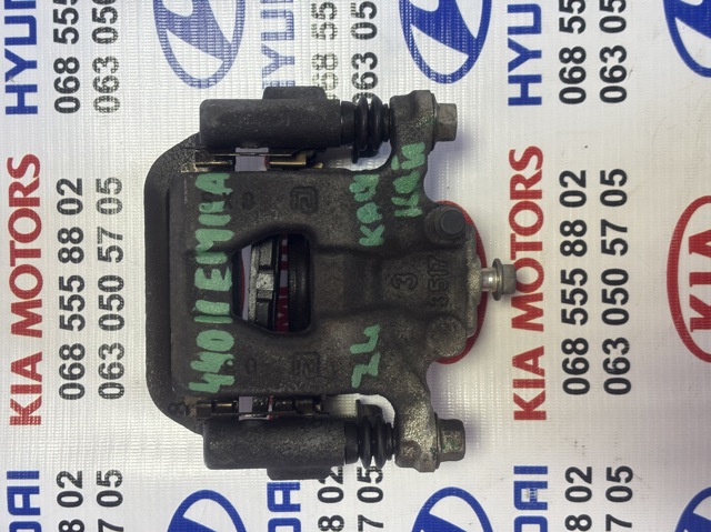 Задній гальмівний супорт лівий 44011EM11A NISSAN
