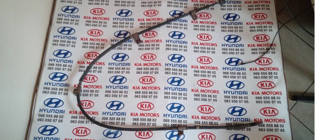 Трос стоянкового гальма задній лівий 597602L300 HYUNDAI
