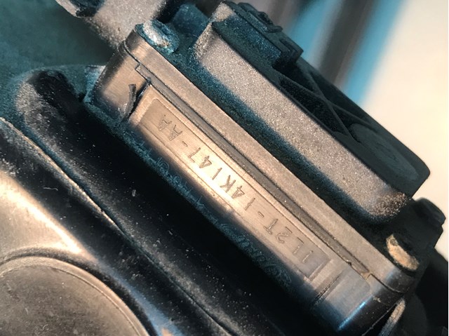 Кнопка привода замка крышки багажника (двери 3/5-й (ляды) 1L2T14K147AA