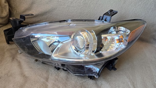 Основна фара в зборі ліва GHR451040 MAZDA