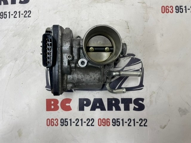 Блок дросельної заслінки 1450A233 MITSUBISHI