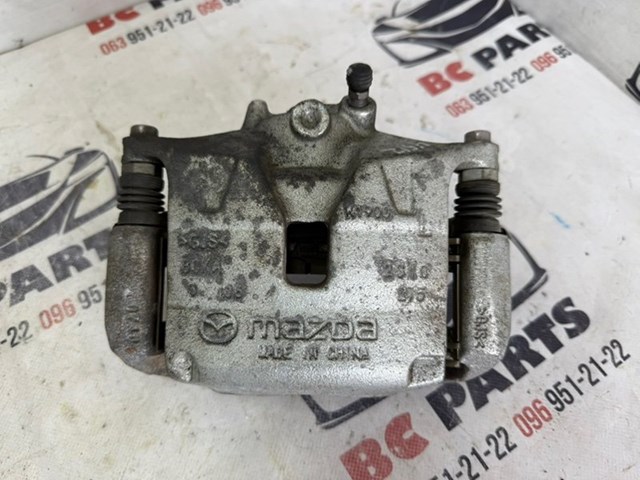 Супорт гальмівний, передній, лівий BCYA3399ZB MAZDA