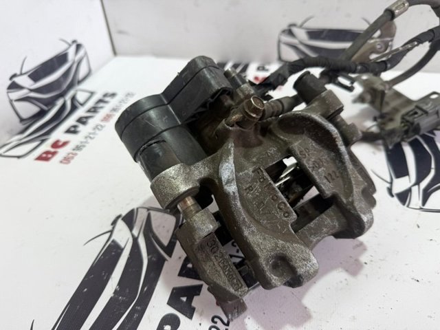 Супорт гальмівний задній правий DG9Z2552C FORD