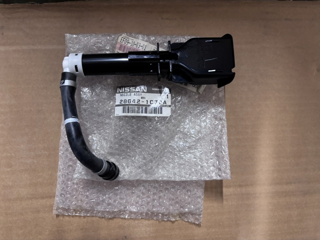 Форсунка омивача фари передньої, лівої 286421CJ0A NISSAN