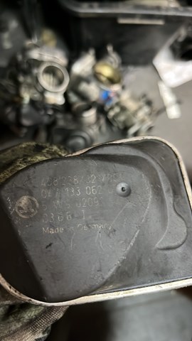 Дросільна заслінка в зборі 047133062D VAG