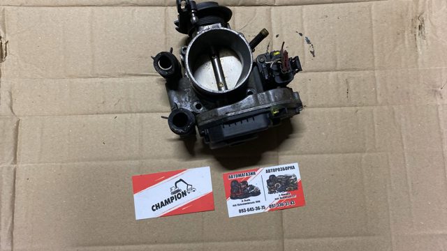 Дросільна заслінка в зборі 058133063H VAG