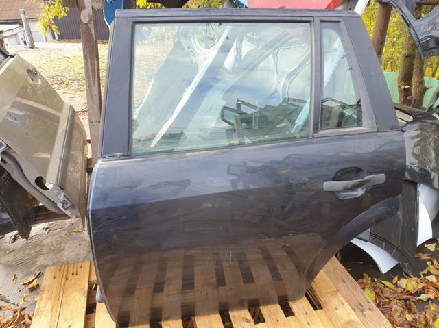 Скло заднє ліве 1303633 FORD