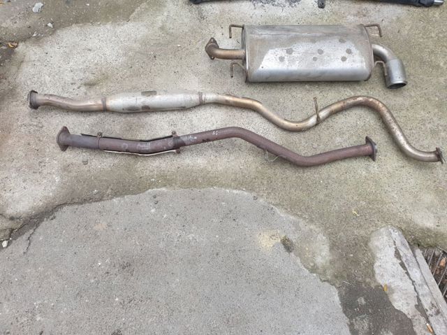 Штани глушника передні 44611AA380 SUBARU