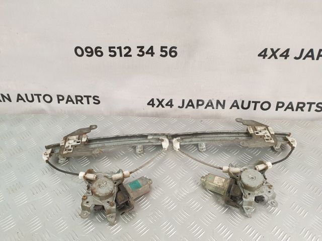 Двигун стеклопод'емника двері задньої, лівої 8073189915 NISSAN