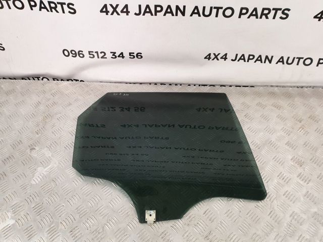 Скло заднє праве EG2272510 MAZDA