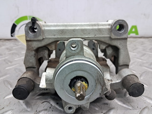 Супорт гальмівний задній правий JX6Z2386L FORD