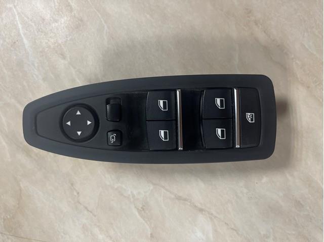Кнопки переднього лівого склопід'ємника 61319362107 BMW