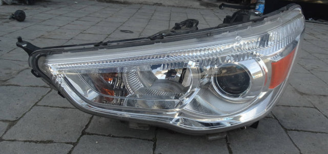 Фара ліва передня 8301B587 MITSUBISHI