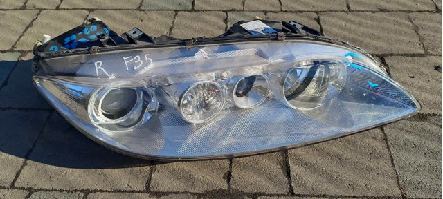 Фара передня права F014002618 MAZDA