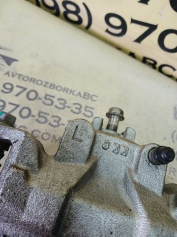 Супорт гальмівний, передній, лівий 410113TA0C NISSAN