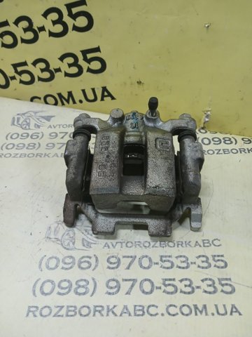 Задній гальмівний супорт лівий 440111AA0A NISSAN