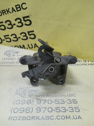 Задній гальмівний супорт лівий 5QM615423A VAG