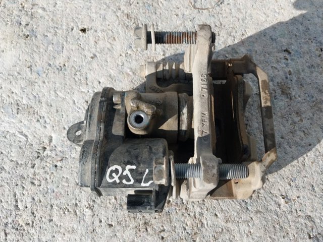 Задній гальмівний супорт лівий 80A615403A VAG