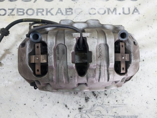 Супорт гальмівний, передній, лівий 95B615123H VAG
