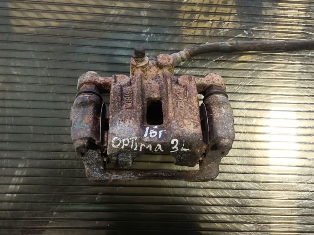 Задній гальмівний супорт лівий 58210C1150 HYUNDAI
