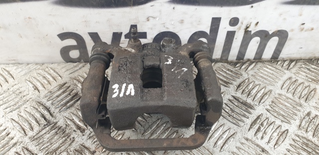 Задній гальмівний супорт лівий 44011JG00A NISSAN