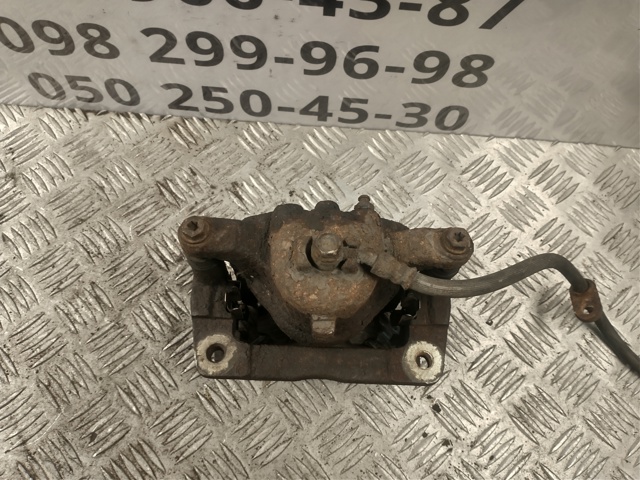Супорт гальмівний, передній, правий 45012SMGE01 HONDA