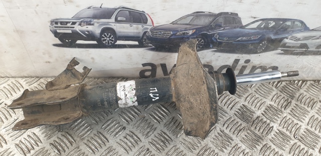 Амортизатор передньої підвіски, лівий 543038H726 NISSAN