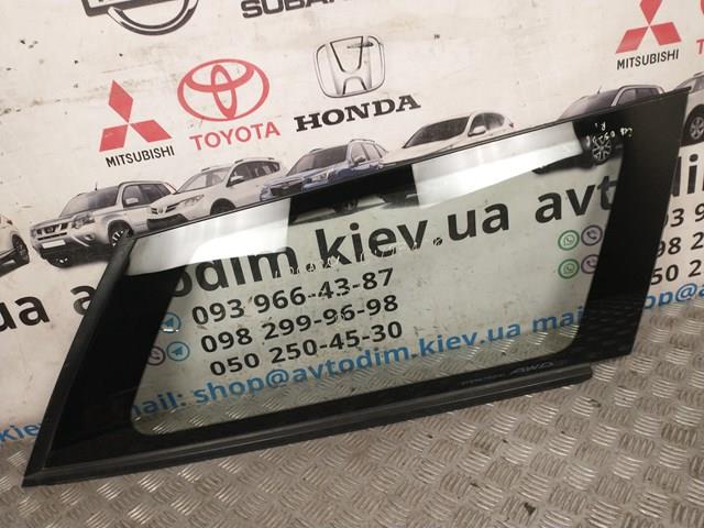 Скло багажного відсіку, праве 65210AG080 SUBARU