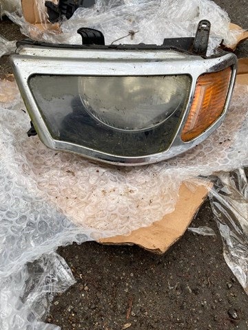 Фара ліва Mitsubishi L 200 IV