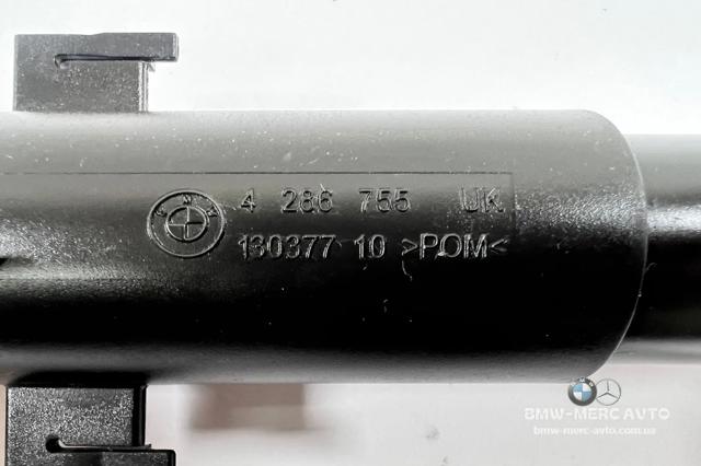 Форсунка омивача фари передньої, лівої 7308525 BMW