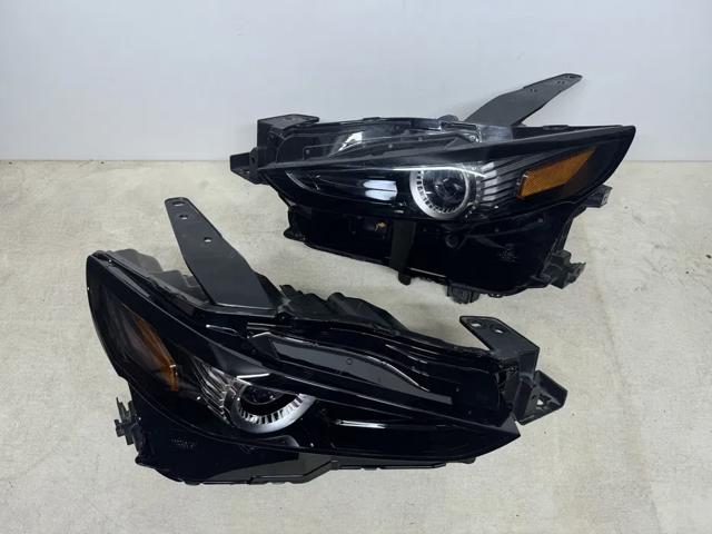 Фара ліва DGH951040A MAZDA