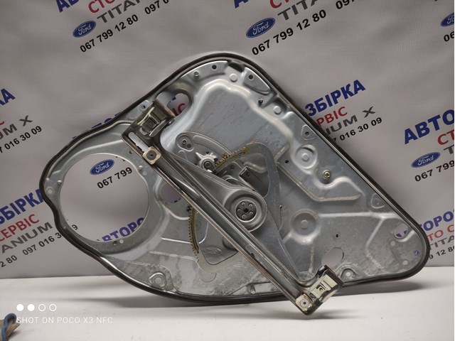 Механізм стеклопод'емника двері задньої, лівої 1738647 FORD
