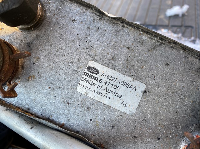 Радіатор масляний (холодильник), під фільтром AH327A095AA LAND ROVER
