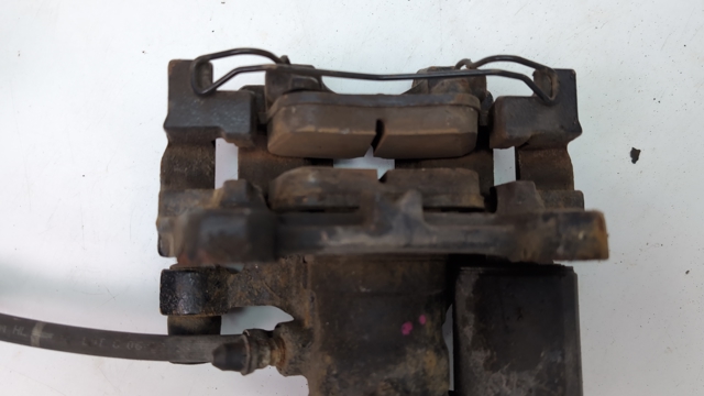 Задній гальмівний супорт лівий DG9Z2553C FORD